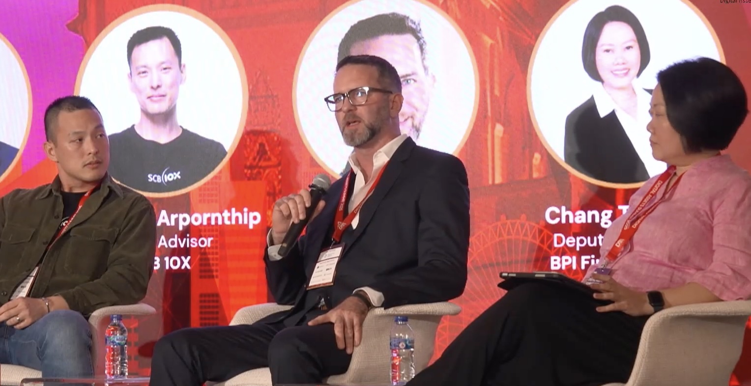 Phil Barkett speaking onstage at the Digital Assets Association Summit during Token2049